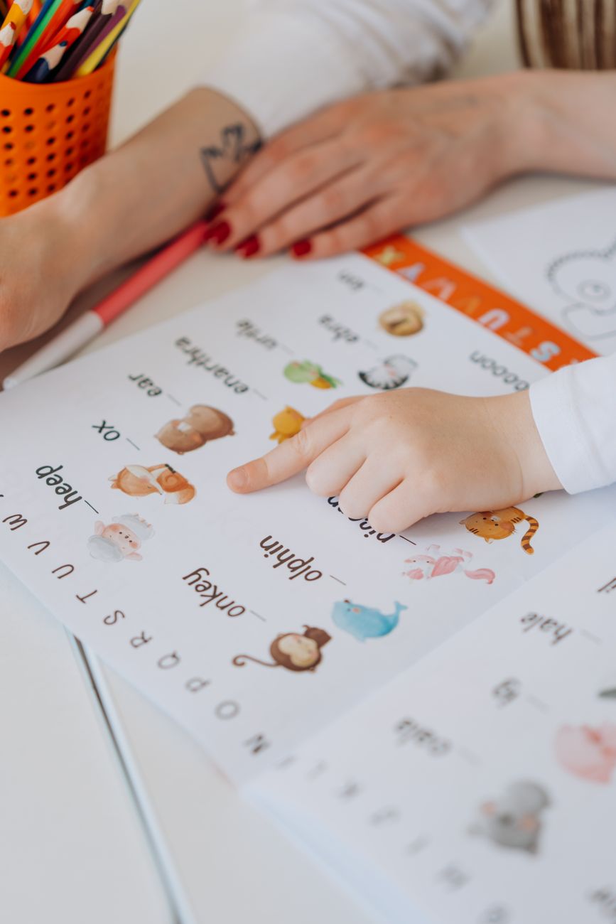 a close up shot of a child reading an educational book