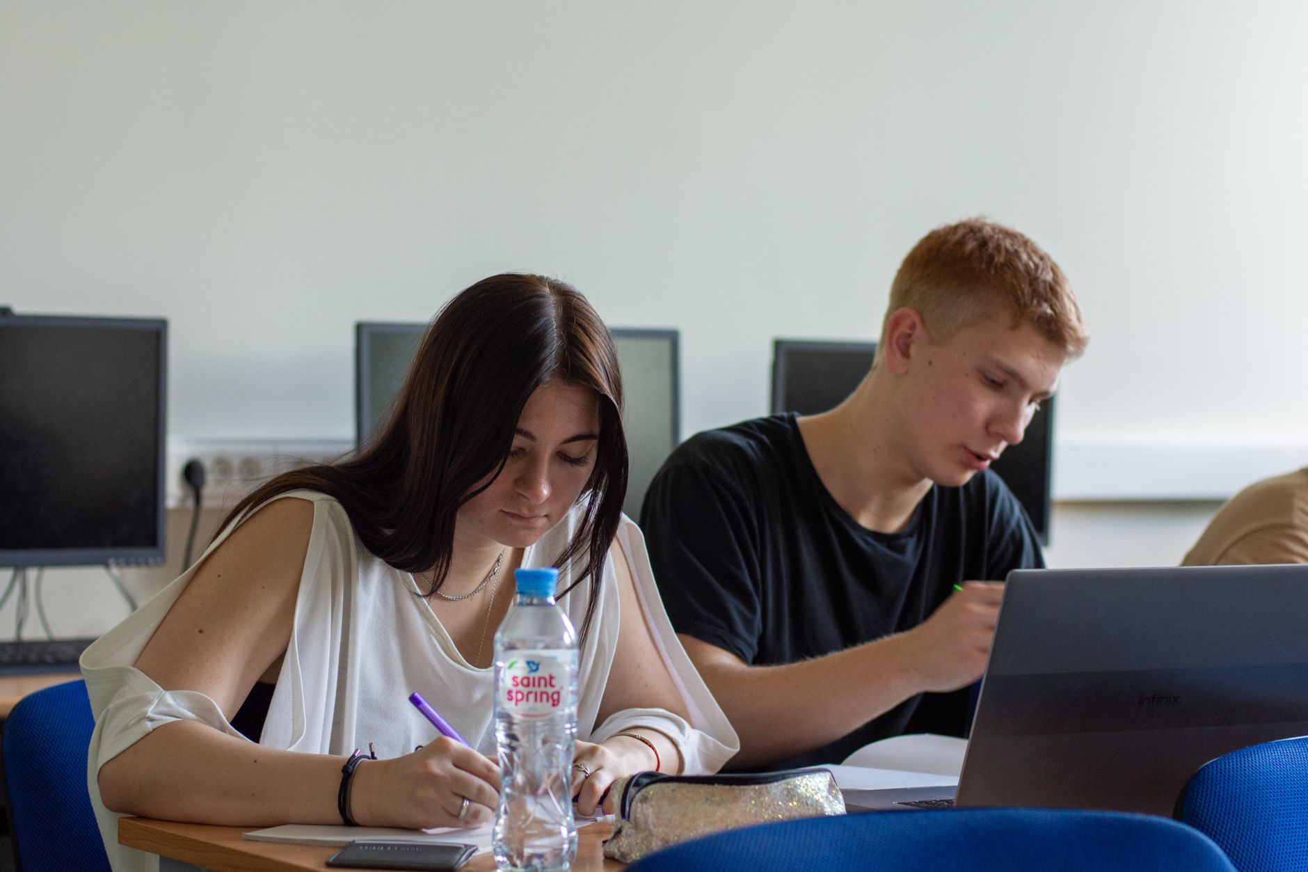 students studying in computer lab setting