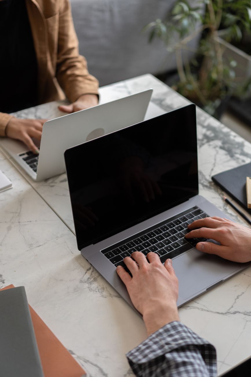 person typing on a laptop