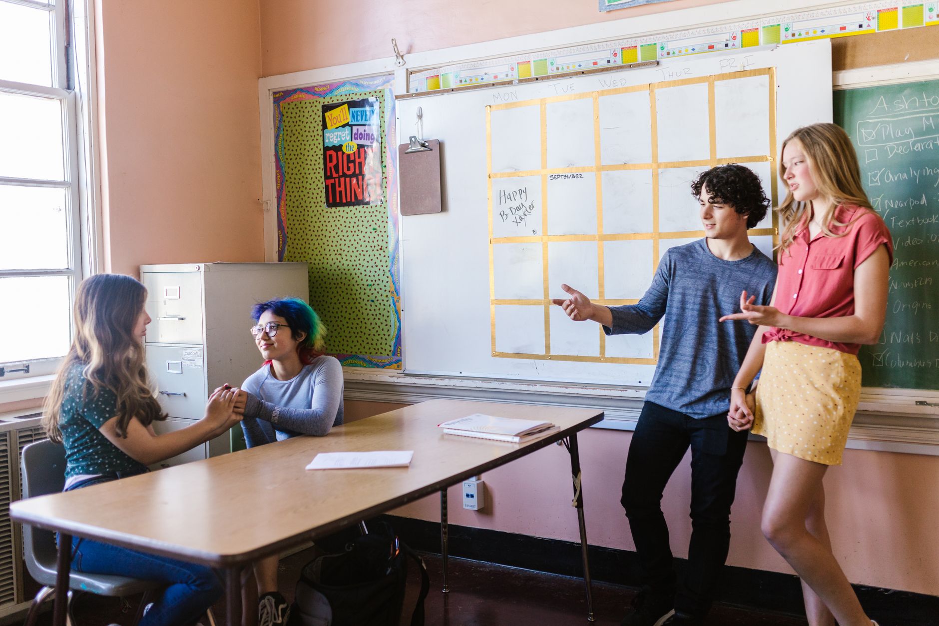 students having a conversation inside the classroom