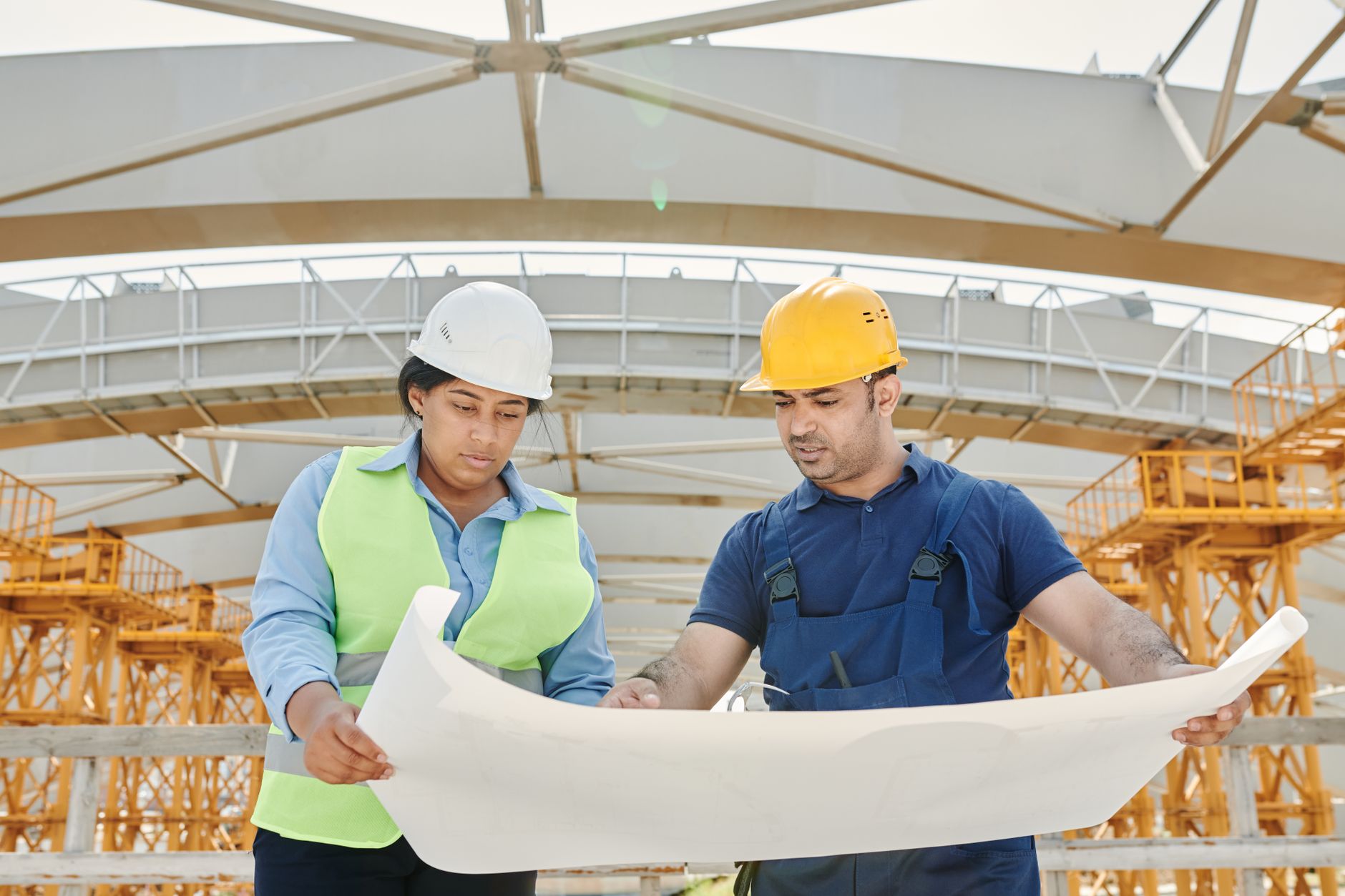 a man and woman wearing safety helmets