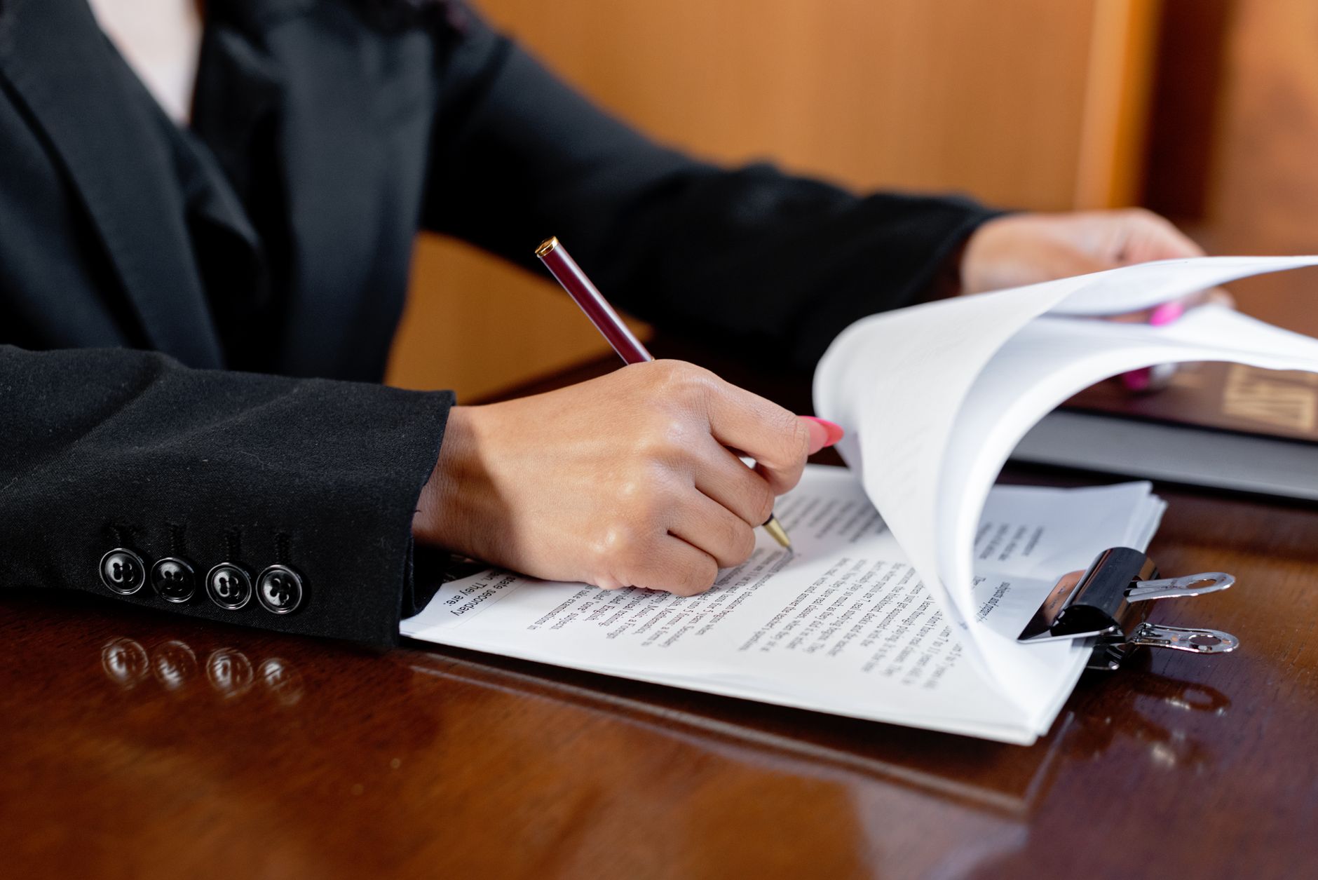 a person writing on the document